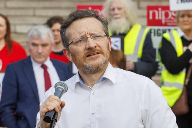 Donal O'Cofaigh speaks to supporters of community group SOAS (Save Our Acutes Services) from Fermanagh at Parliament Buildings at Stormont in Belfast in February, as they deliver letters demanding the restoration of emergency surgery at South West Acute Hospital (SWAH) in Enniskillen.