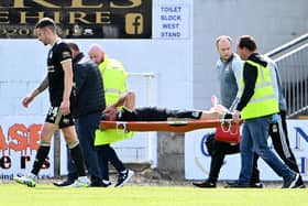 Crusaders defender Jimmy Callacher was carried off with a knee injury against Newry City. PIC: INPHO/Stephen Hamilton