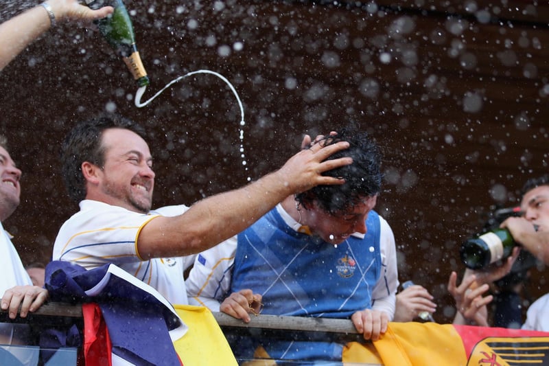 Graeme McDowell and Rory McIlroy enjoying the balcony celebrations in Wales. (Photo by Ross Kinnaird/Getty Images)