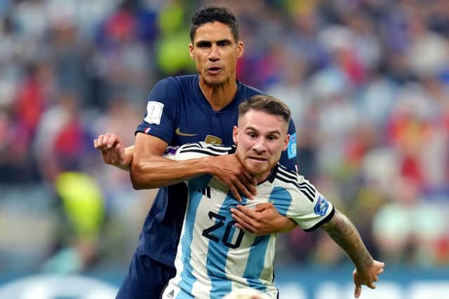 France's Raphael Varane (back) and Argentina's Alexis Mac Allister battle for the ball during the FIFA World Cup final at Lusail Stadium, Qatar.