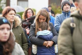 (parental permission given) Louise Devine with her daughter Lilly Hegarty 8, at a vigil in Milford, Co Donegal for the victims of the explosion at Applegreen service station in the village of Creeslough in Co Donegal, where ten people have now been confirmed dead. Picture date: