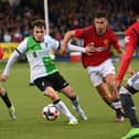 Liverpool’s Josh Davidson in action with Manchester United’s James Scanlon and Gabriele Biancheri in the Elite clash at Coleraine Showgrounds