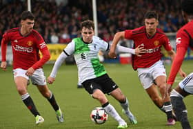 Liverpool’s Josh Davidson in action with Manchester United’s James Scanlon and Gabriele Biancheri in the Elite clash at Coleraine Showgrounds