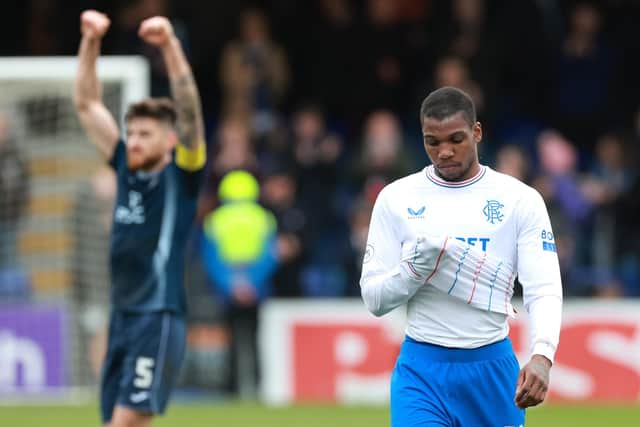 Rangers' Dujon Sterling (right) looks dejected as Ross County's Jack Baldwin celebrates after the final whistle in the cinch Premiership match at the Global Energy Stadium, Dingwall. (Photo by Steve Welsh/PA Wire).
