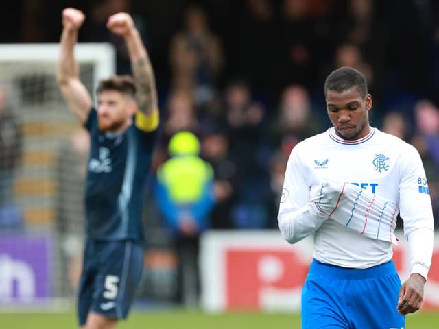 Rangers' Dujon Sterling (right) looks dejected as Ross County's Jack Baldwin celebrates after the final whistle in the cinch Premiership match at the Global Energy Stadium, Dingwall. (Photo by Steve Welsh/PA Wire).