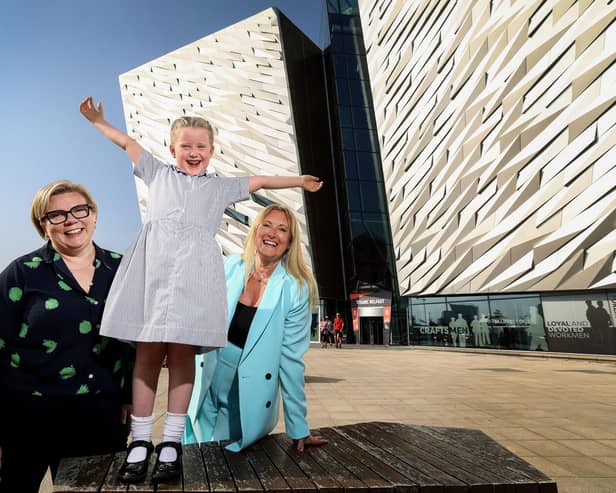 Titanic Belfast has announced the introduction of a new School Transport Bursary to give schools in some of Northern Ireland’s most deprived areas the opportunity to apply for free transport to support them when visiting the world-leading attraction in the 2023/24 academic year. Pictured are Caroline McComb, director of McComb’s Coach Travel, Judith Owens MBE, chief executive of Titanic Belfast and local school pupil Zoe Kennedy