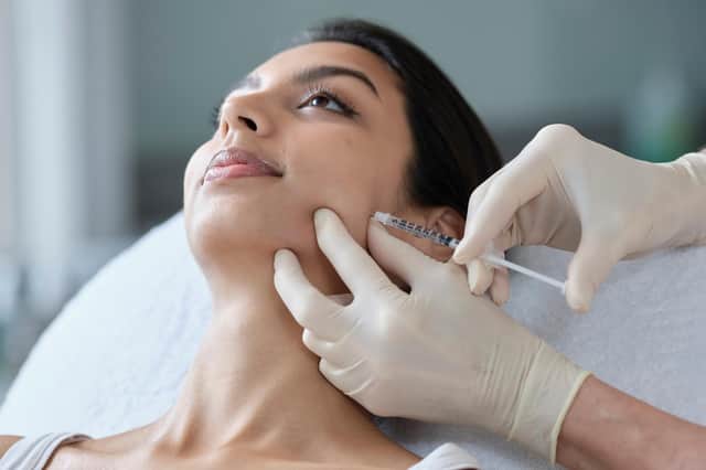 A woman having Botox injections for bruxism (teeth grinding)