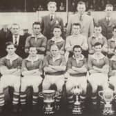 Sammy Wilson (front row, left) with players and officials celebrating Glenavon's treble-winning season in 1956/57 that featured Irish League, Irish Cup and Gold Cup glory. Pic courtesy of Glenavon FC
