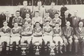 Sammy Wilson (front row, left) with players and officials celebrating Glenavon's treble-winning season in 1956/57 that featured Irish League, Irish Cup and Gold Cup glory. Pic courtesy of Glenavon FC