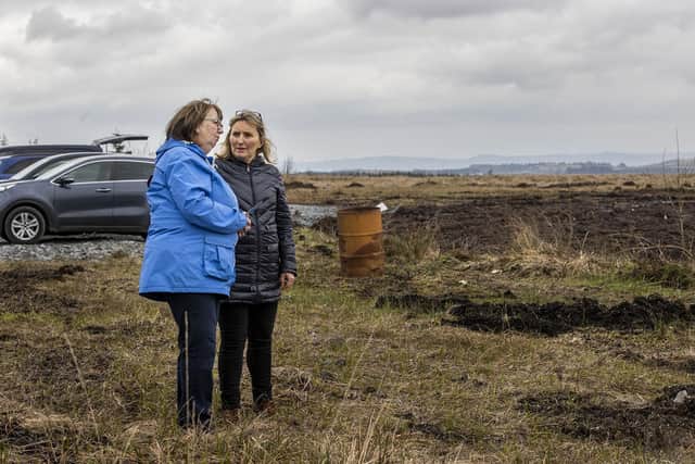 Dympna Kerr,(left) the sister of Columba McVeigh, with Sandra Peake from the Wave Trauma Centre, at Bragan bog near Emyvale in Co Monaghan