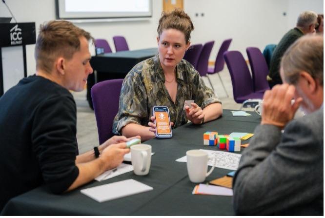 Participants playing a Business Simulation focusing on collaboration
