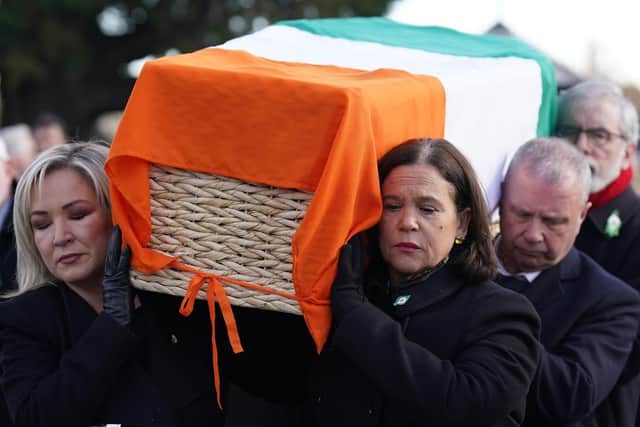 Sinn Fein vice president Michelle O'Neill (left), Sinn Fein Party leader Mary Lou McDonald (right) and former Sinn Fein leader Gerry Adams (back right) carry the coffin of former Sinn Fein general secretary Rita O'Hare at Glasnevin Cemetery, Dublin