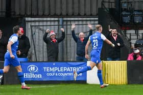 Leroy Millar celebrates in front of the Larne fans after scoring against Carrick Rangers. (Photo by Andrew McCarroll/Pacemaker Press)