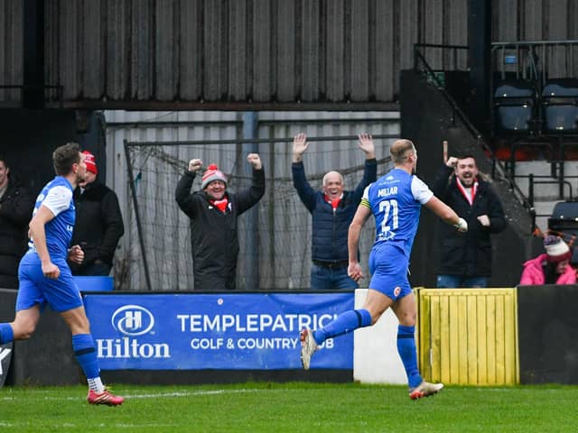 Leroy Millar celebrates in front of the Larne fans after scoring against Carrick Rangers. (Photo by Andrew McCarroll/Pacemaker Press)