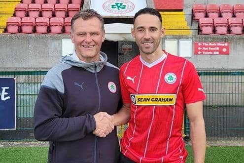 New Cliftonville striker Sam Ashford with manager Jim Magilton. PIC: Cliftonville FC