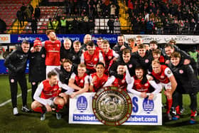 Larne celebrate victory in the County Antrim Shield final after beating Glentoran at Seaview