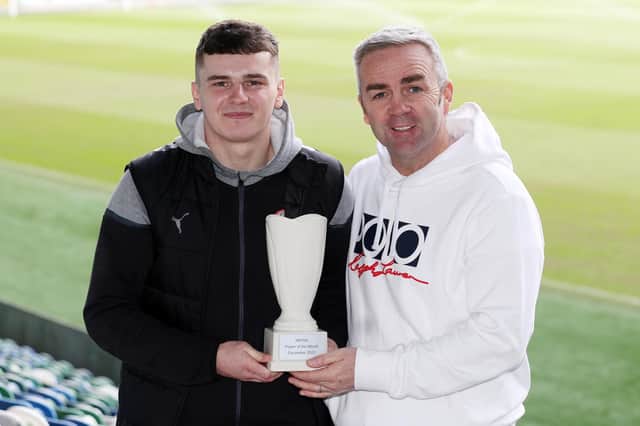 Cliftonville's Ronan Hale has won the Dream Spanish Homes Player of the Month prize for December from the NIFWA. Also included is Gerry Flynn (Dream Spanish Homes)