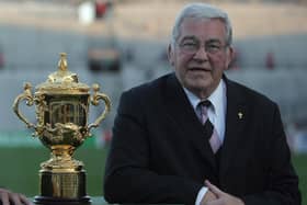 Syd Millar the chairman of the International Rugby Board poses near a replica of the Webb Ellis trophy before the rugby union World cup match Argentina vs. Namibia, 22 September 2007 at the Velodrome stadium in Marseille.  AFP PHOTO / FRED DUFOUR  (Photo credit should read FRED DUFOUR/AFP via Getty Images)