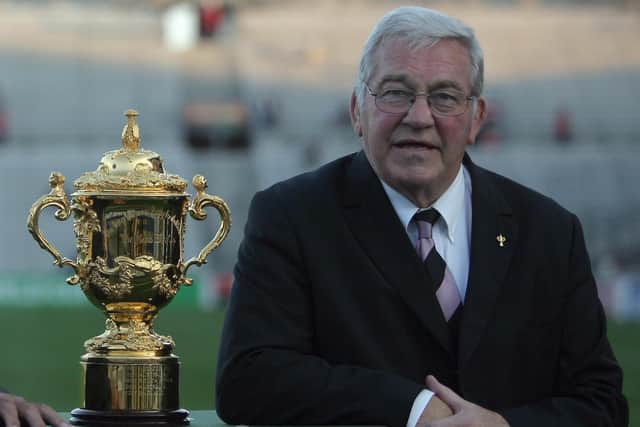 Syd Millar the chairman of the International Rugby Board poses near a replica of the Webb Ellis trophy before the rugby union World cup match Argentina vs. Namibia, 22 September 2007 at the Velodrome stadium in Marseille.  AFP PHOTO / FRED DUFOUR  (Photo credit should read FRED DUFOUR/AFP via Getty Images)
