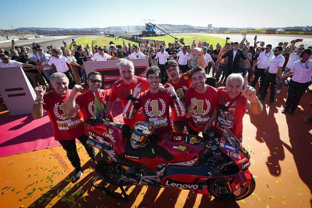 Italy's Francesco Bagnaia celebrates winning the MotoGP world title at Valencia in Spain with his Ducati team.