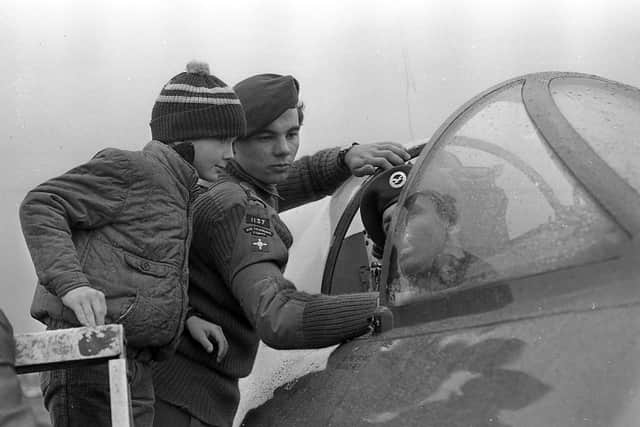Martin Shute of the Air Training Corps shows the controls of a Hawker Hunter fighter to James Armstrong from Bangor at the Ulster Air Show at Newtownards in September 1981. Picture: News Letter archives/Darryl Armitage