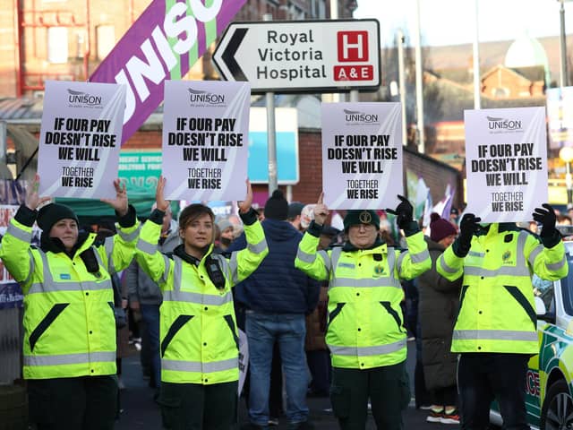 More than 25,000 healthcare staff in Northern Ireland have held a one-day strike as part of a pay dispute.
