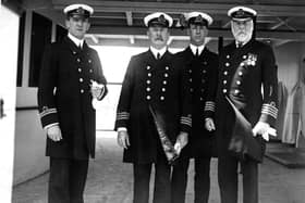 Officers of the White Star liner Olympic, including Lieutenant Murdoch (far left) and Captain Edward Smith (right) later captain of the ill-fated Titanic, 9th June 1911.  (Photo by Topical Press Agency/Hulton Archive/Getty Images)
