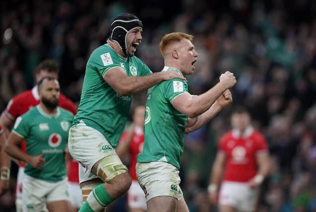Ireland's Ciaran Frawley (right) celebrates with Caelan Doris after scoring his side's third try during the Guinness Six Nations match at the Aviva Stadium against Wales. (Photo by Niall Carson/PA Wire)