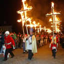 Members of the Cliffe Bonfire Society parading flaming crosses through the streets of Lewes, East Sussex, to celebrate the foiling of Guy Fawkes' gunpowder plot to destroy Parliament in 1605. Modern villains such as Donald Trump and Vladimir Putin also now get burnt in effigy as a form of peaceful protest. Picture: PA Photo/Chris Ison