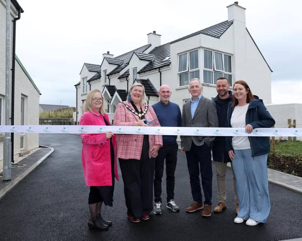 (L-R): Heloise Brown, Department For Communities, Sandra Hunter, Deputy Mayor of Causeway Coast and Glens Council, new tenant Ruari Morgan, Chief Executive of Rural Housing Association, Stephen Fisher, Chair of Rural Housing Association, Tom Potter, and Pamela Johnston, Northern Ireland Housing Executive Rural Unit