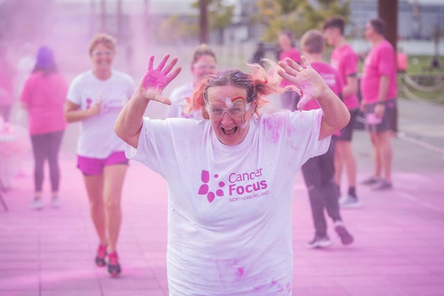 Hundreds of runners covered themselves head-to-toe in powder for Cancer Focus NI’s famous annual Pink Run