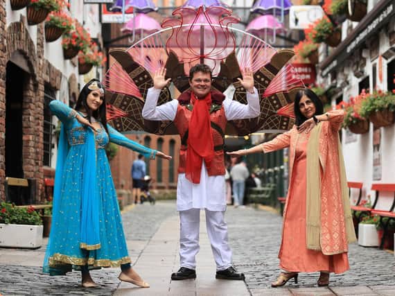 (left to right) Leyla Gallius (ArtsEkta dancer), Stephen Begg performer and Nisha Tandon CEO of ArtsEkta at the launch of the Belfast Mela Festival at Commercial court in Belfast. Photo: Liam McBurney/PA Wire