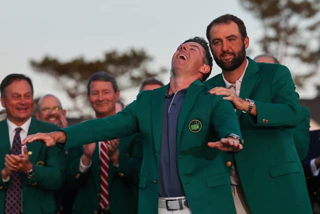 Rory McIlroy reacts with joy as he is awarded the coveted Green Jacket by Masters Champion Scottie Scheffler after the final round of the 2025 Masters Tournament at Augusta National Golf Club on April 13, 2025 in Augusta, Georgia. Photo: Michael Reaves/Getty Images