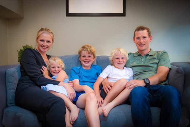 Sign language interpreter Kristina Sinclair with her husband Anthony and their three children