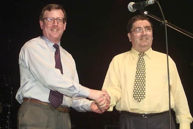 Unionist and national powersharing: UUP leader David Trimble and SDLP leader John Hume shake hands during a concert by U2 and Ash at the Waterfront to celebrate promote the referendum backing for the Good Friday Agreement in May 1998. However today the DUP and a UUP negotiator of the deal say that the government budget of £600,000 to celebrate the 25th annievrsary of the agreement is misplaced while the Northern Ireland Protocol continues to "trash" the 1998 agreement.
