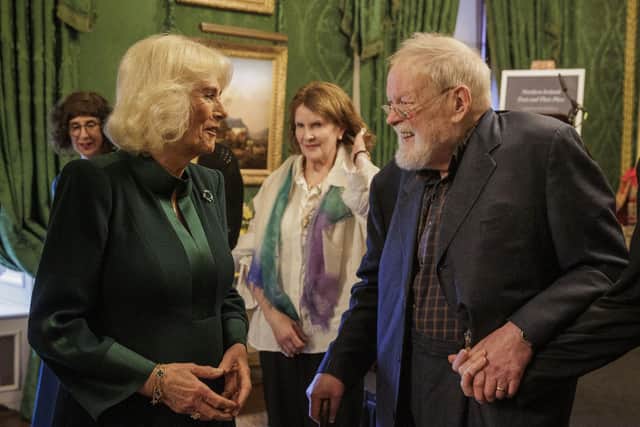 Queen Camilla speaking with contemporary poet Micheal Longley as she attends an event hosted by the Queen's Reading Room to mark World Poetry Day at Hillsborough Castle in Belfast, during her two-day official visit to Northern Ireland. Picture date: Thursday March 21, 2024. PA Photo.
