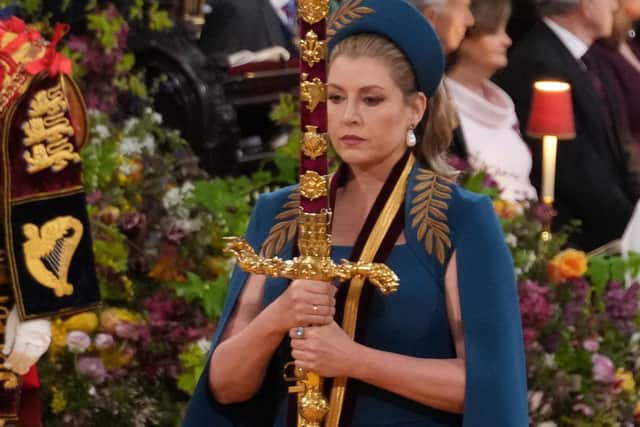 Lord President of the Council, Penny Mordaunt, carrying the Sword of State,  in the procession through Westminster Abbey ahead of the coronation ceremony of King Charles III and Queen Camilla in London.