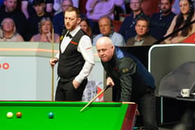 Northern Ireland's Mark Allen (left) up against John Higgins during the thrilling Cazoo World Snooker Championship match at the Crucible Theatre, Sheffield on Monday. (Photo by Martin Rickett/PA Wire)