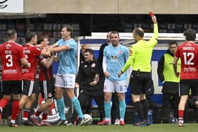 Larne’s Chris Gallagher is awarded a red card for a tackle on Elliot Dunlop. (Photo by INPHO/Stephen Hamilton)