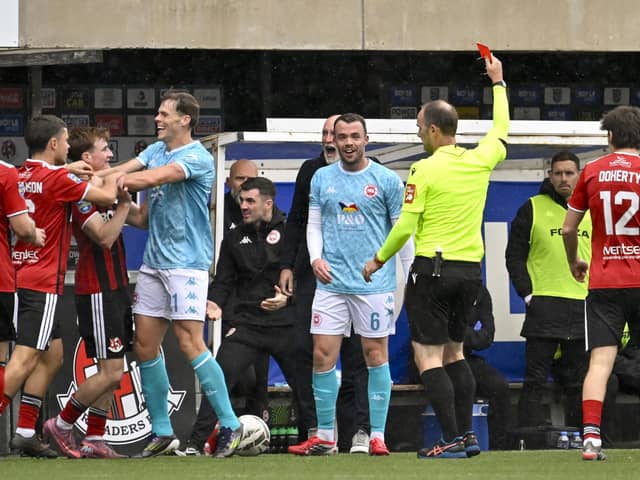 Larne’s Chris Gallagher is awarded a red card for a tackle on Elliot Dunlop. (Photo by INPHO/Stephen Hamilton)