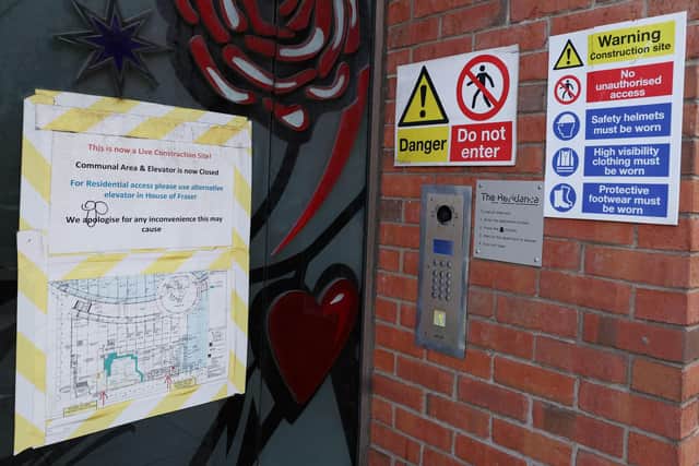 Warnings at the defective apartments at Victoria Square in Belfast City Centre. Owners had to leave the building in 2019 due to structural failings and have recently had their bid for compensation struck out of court. Photo by Jonathan Porter/Press Eye.