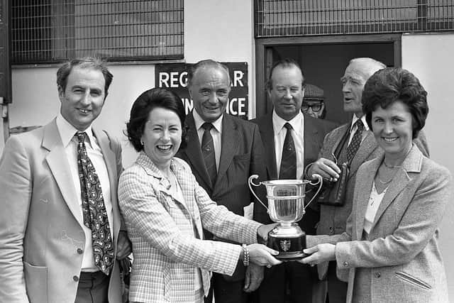 Pictured in late July 1980 is Mrs Frances Eastwood who is seen presenting the Thomas Joseph Eastwood Memorial Trophy to Mrs Freda Quinn, sister of the owner, Mr P O’Loughlin, left, after Court Play romped home to victory at Down Royal. Included are, Mr Paddy Hunt, chairman of Down Royal, Mr Barry Ross, the registrar, and the jockey’s father, Mr Clem Magnier. Picture: News Letter archives/Darryl Armitage