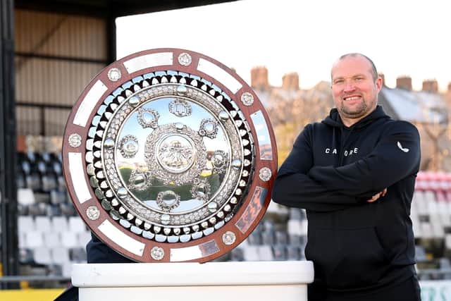 Glentoran manager Warren Feeney with the Co Antrim Shield ahead of tonight’s final against Larne at Seaview. (Photo by Stephen Hamilton)