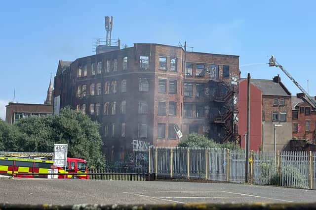 Emergency services attending to a blaze at a derelict listed building in Samuel Street, Belfast. The operation to douse the flames included six fire engines, two aerial appliances and 40 firefighters