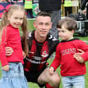 Paul Heatley celebrates with his two children after last season's Irish Cup final success