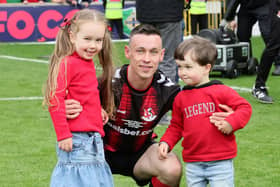 Paul Heatley celebrates with his two children after last season's Irish Cup final success