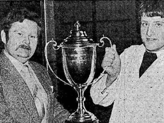 Pictured from Farming Life March 1983 - Harry Marquess, from Muckamore, who won the Farming Life Perpetual Challenge for the best pair of full French cattle, by the same sire, bred the exhibitor. Mr Marquess's, Harry, received the trophy from Farming Life editor, David McCoy. Picture: Farming Life archives/Darryl Armitage