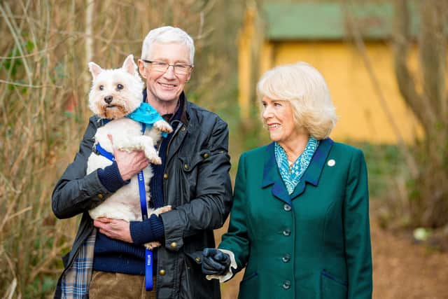 Her Majesty The Queen Consort joins Battersea Ambassador Paul O'Grady and George the West Highland White Terrier at Battersea Brands Hatch site in Kent