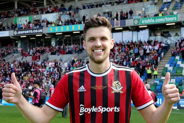 Adam Lecky gives the thumbs up after helping Crusaders lift the Irish Cup against Ballymena United