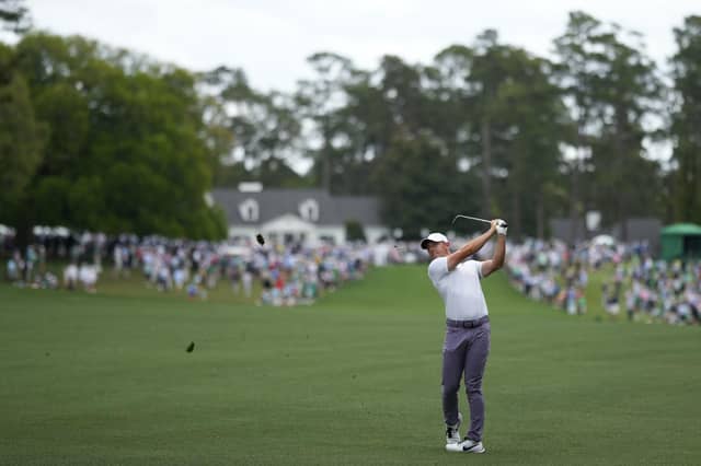 Rory McIlroy hits from the fairway on the first hole during the first round at the Masters golf tournament at Augusta National Golf Club